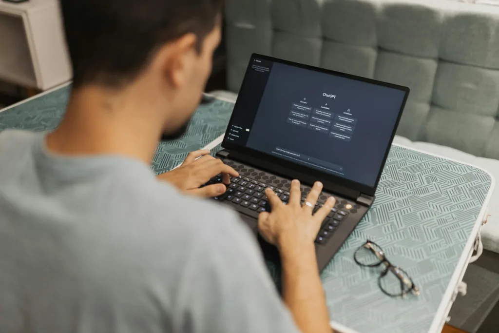 Person using ChatGPT on a laptop