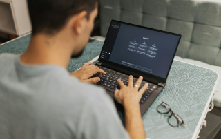 Person using ChatGPT on a laptop