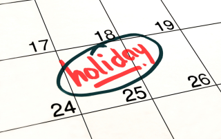 Calendar with a holiday date circled in red marker